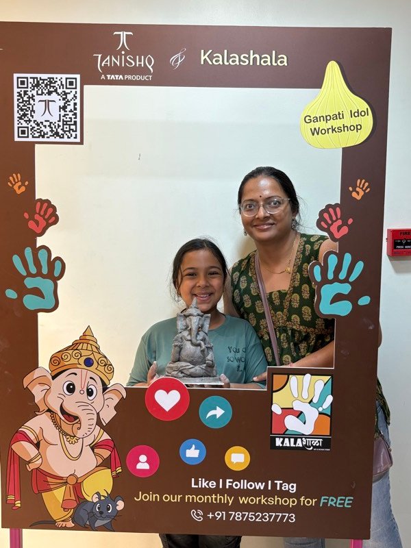 Art workshop participants displaying their finished creations in Pune