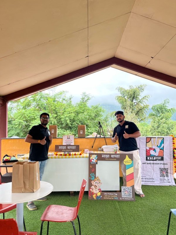 Art workshop participants displaying their finished creations in Pune