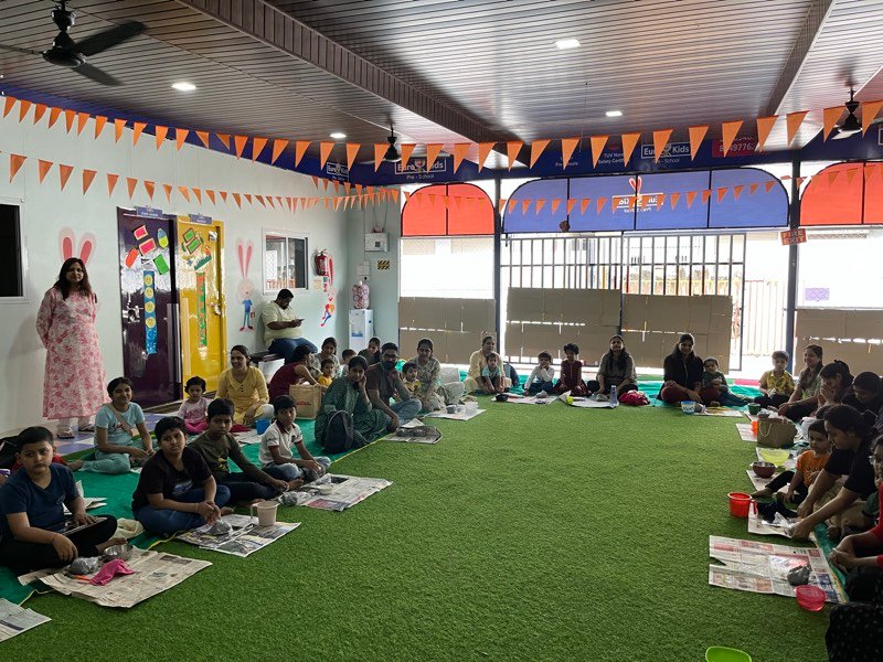 Art workshop participants displaying their finished creations in Pune