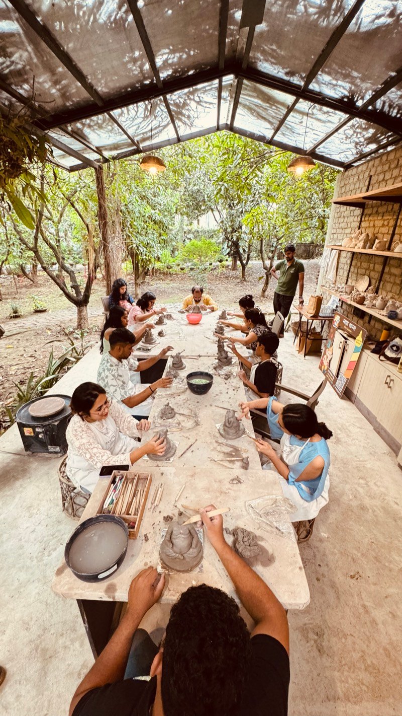 Art workshop participants displaying their finished creations in Pune