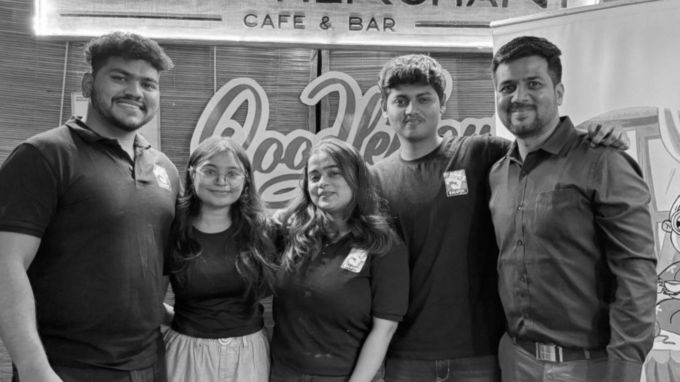 The Kalashala team standing together at a café workshop event